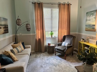 Cozy therapy room with natural light and coastal decor at Florida Coast Counseling Estero