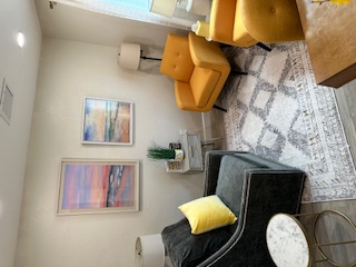 Warm therapy room with sunset artwork at Florida Coast Counseling Fort Myers office