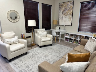Family-friendly therapy room with warm lighting at Naples office